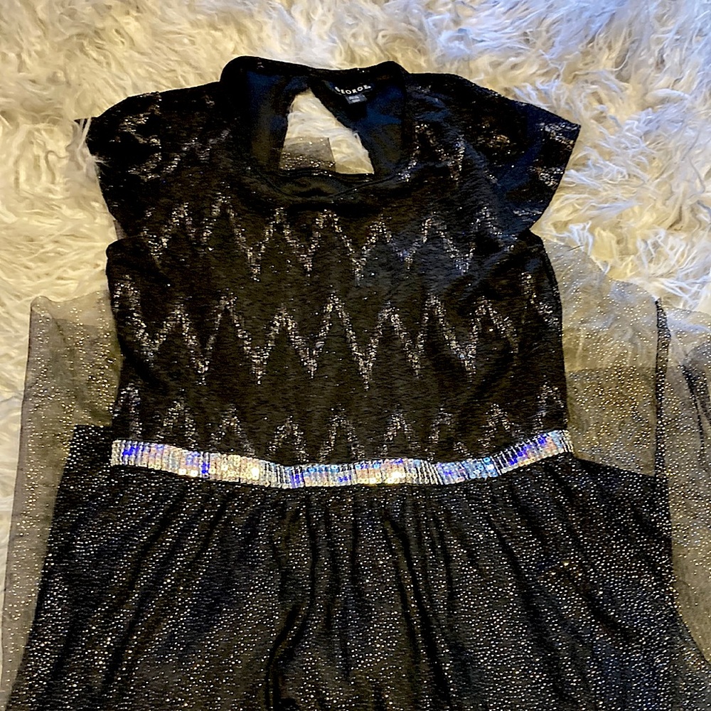 Sparkly black dress. Pretty short with slight short train.